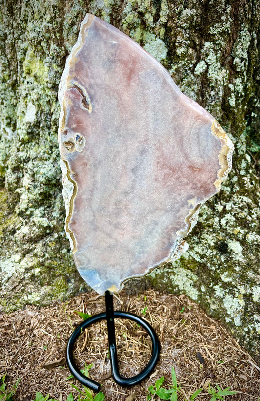 pink amethyst slab on a stand
