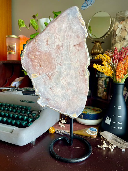 pink amethyst slab on a stand