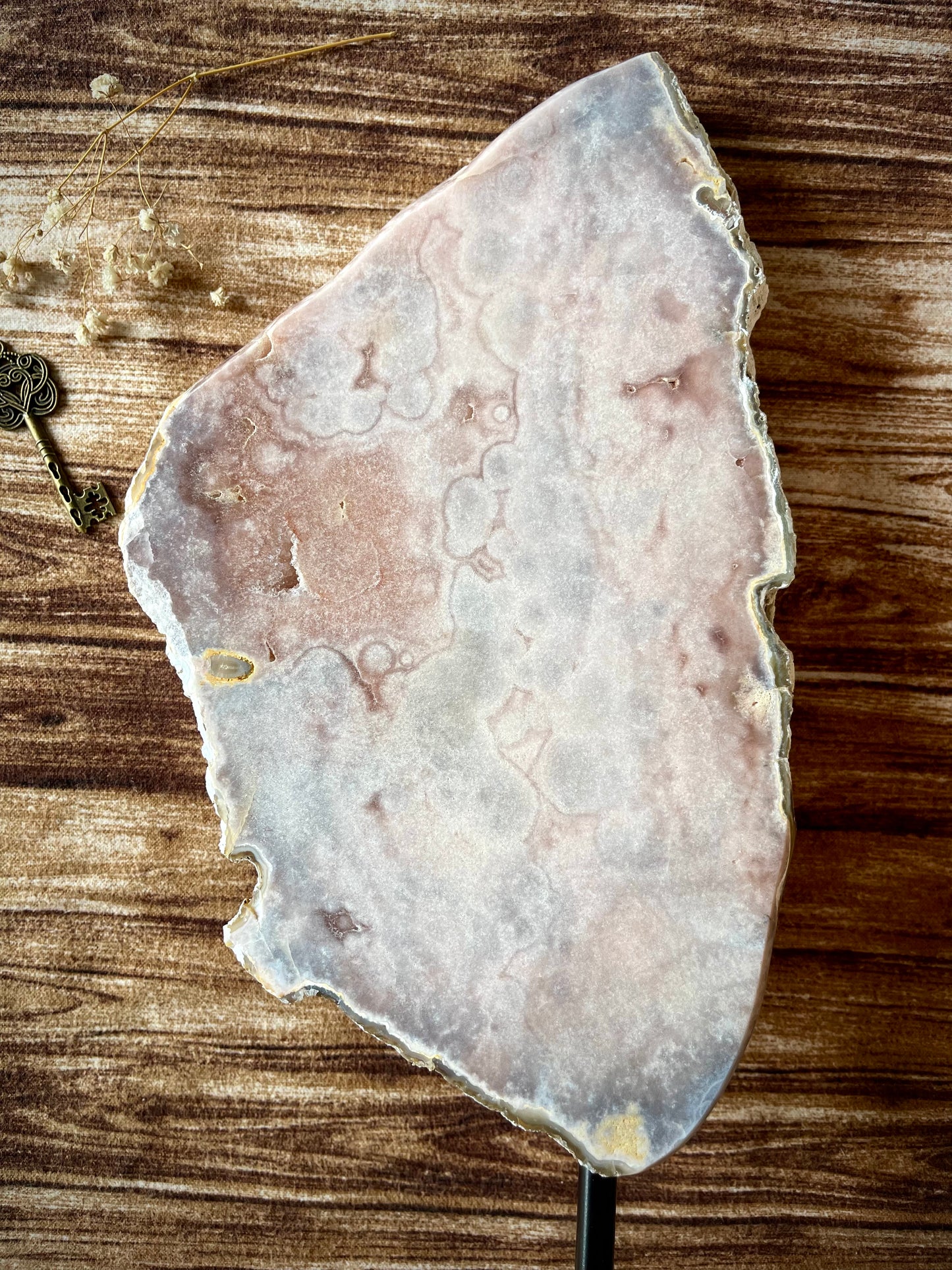 pink amethyst slab on a stand