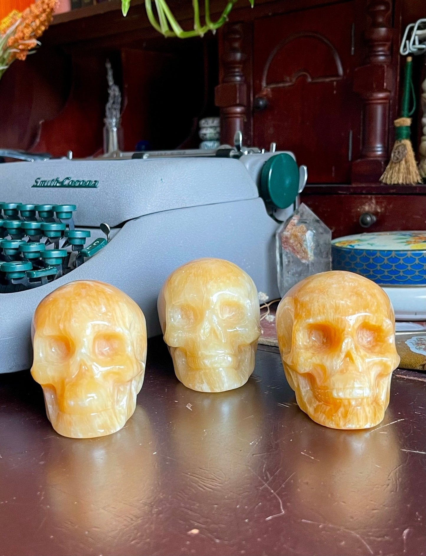 orange calcite skulls - lil shop of light & love