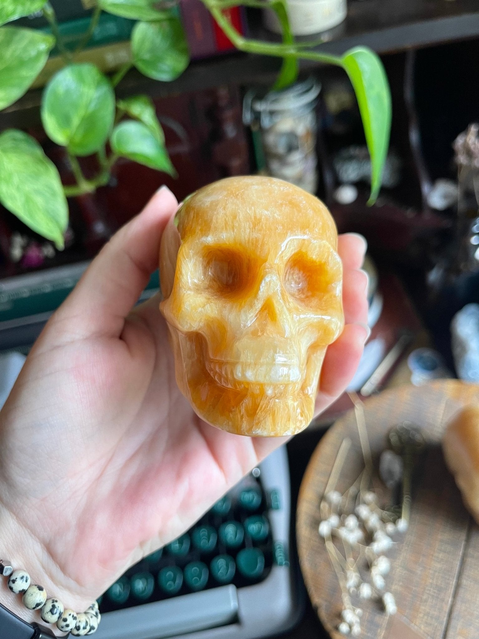 orange calcite skulls - lil shop of light & love