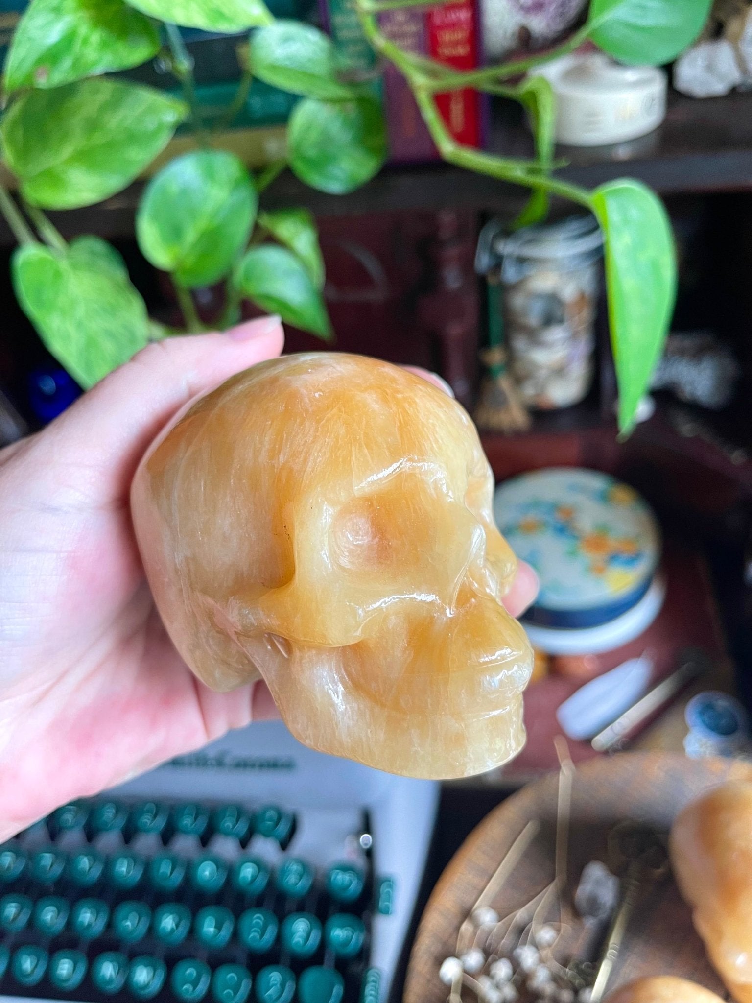 orange calcite skulls - lil shop of light & love