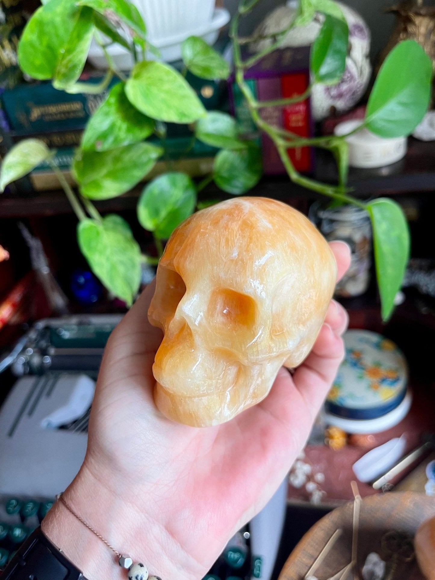 orange calcite skulls - lil shop of light & love