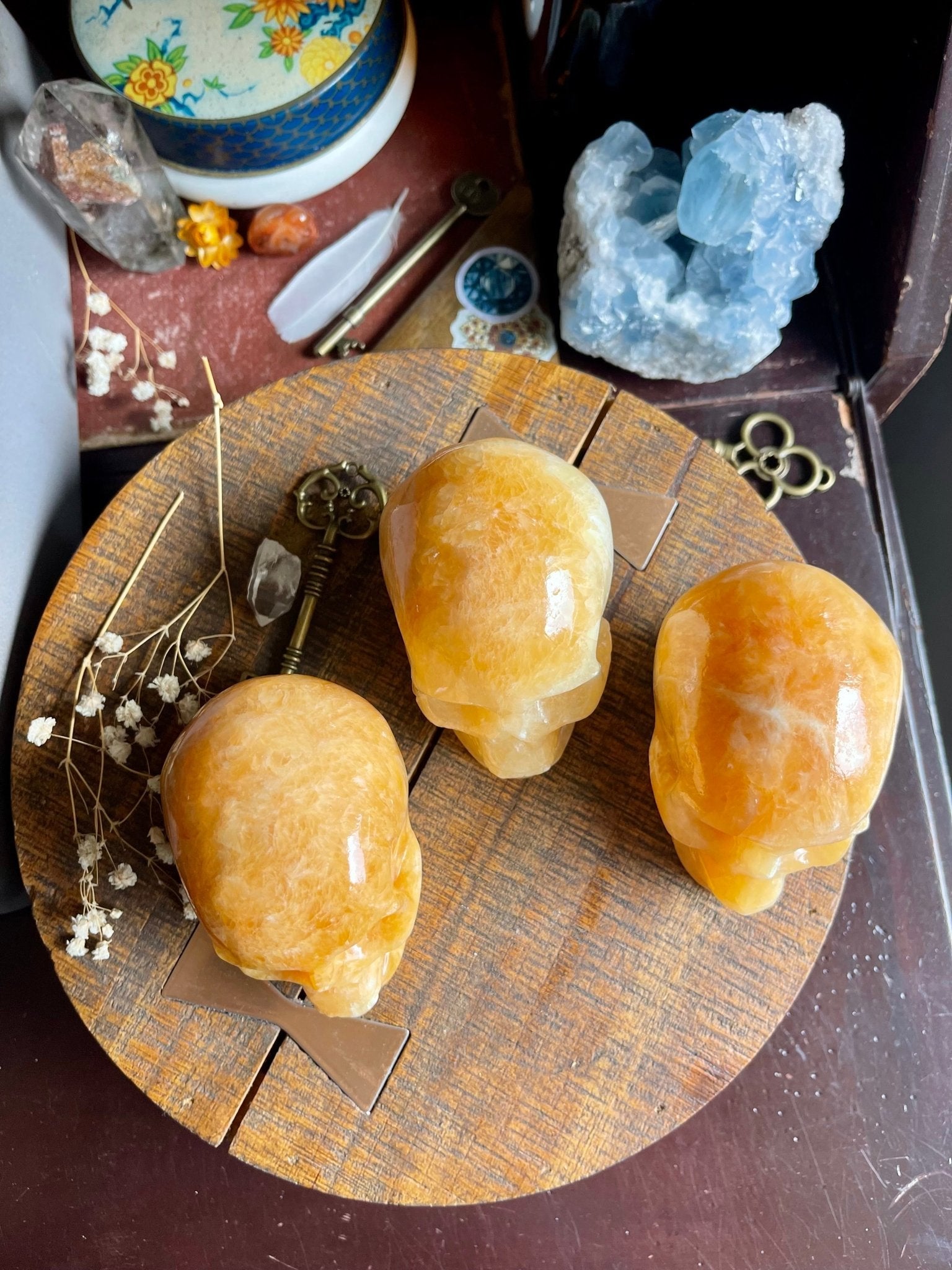 orange calcite skulls - lil shop of light & love