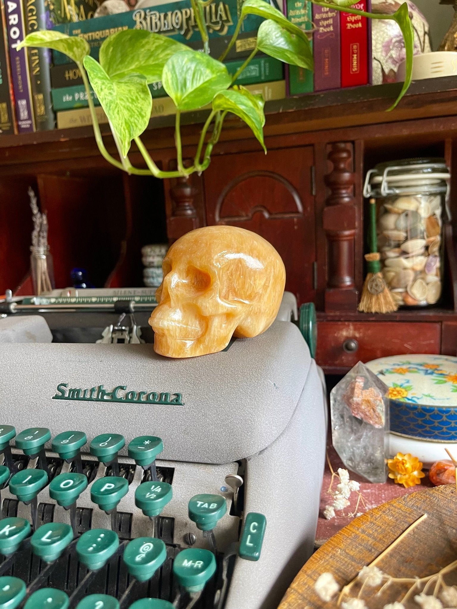 orange calcite skulls - lil shop of light & love