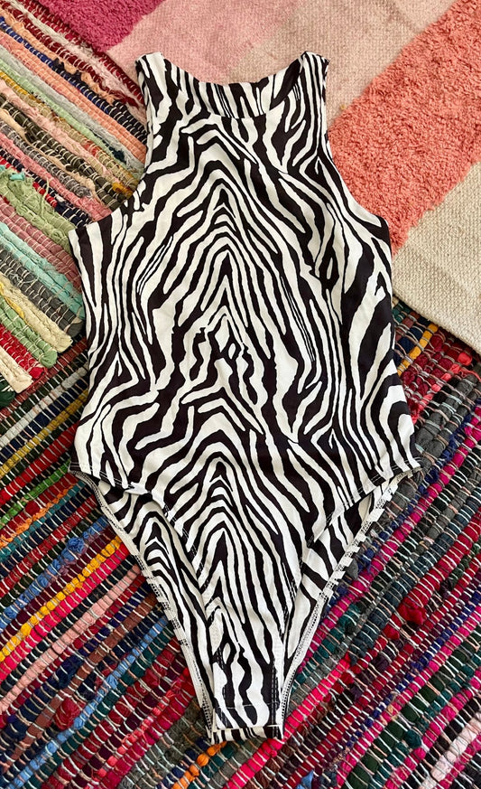 zebra print body suit (used) - Lil Shop of Light & Love
