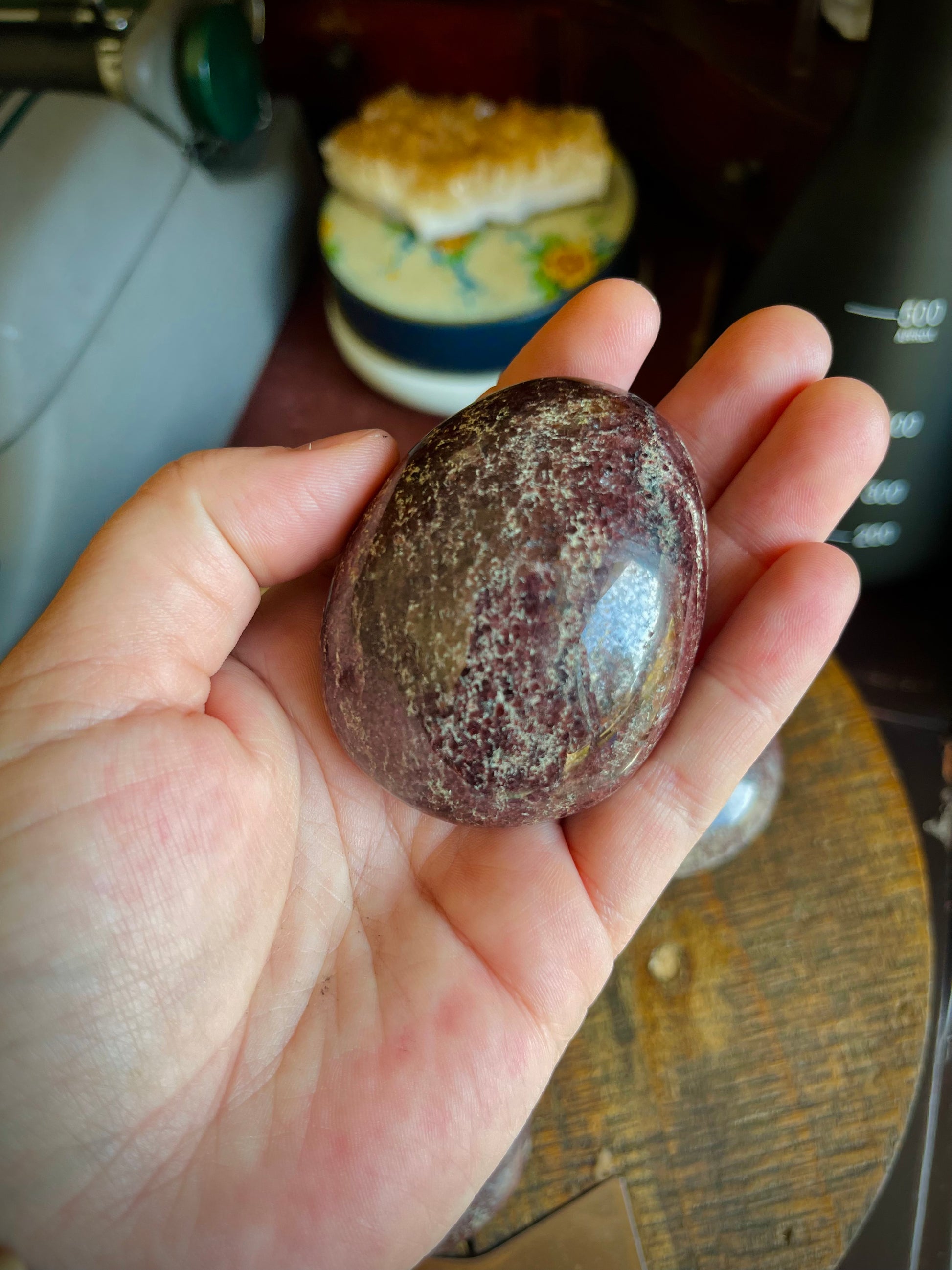 Garnet palm stone in a hand.